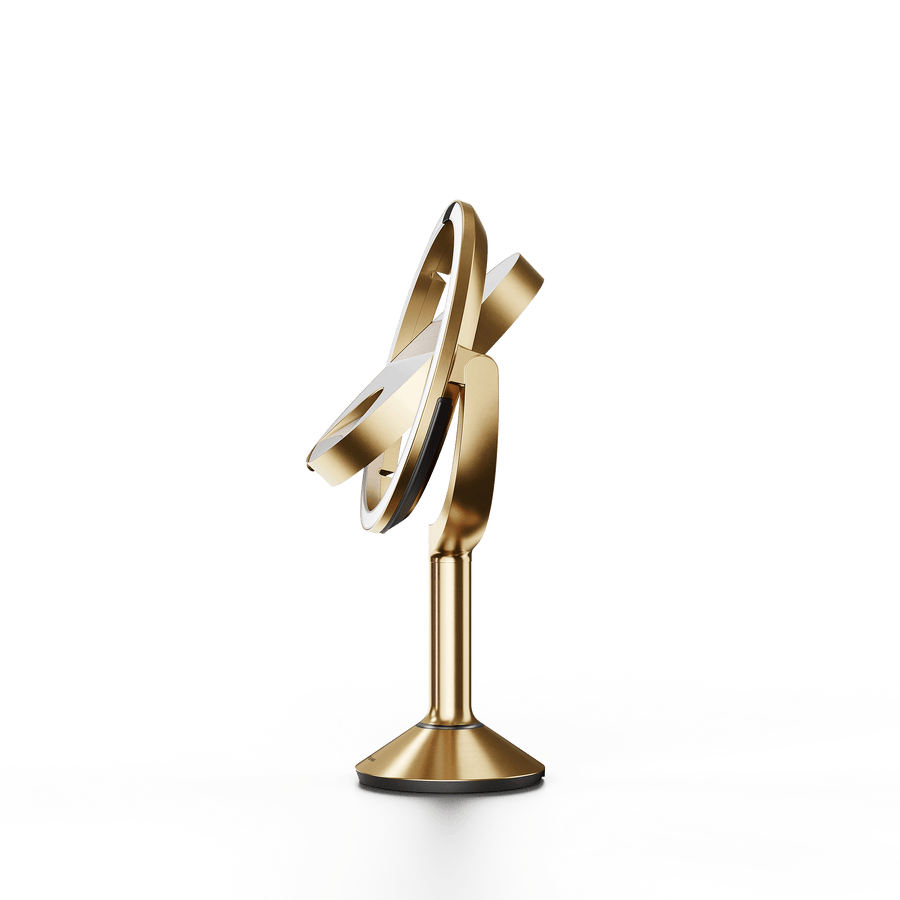 Simplehuman's Sensor Mirror Trio in Brass, flipping angle. 