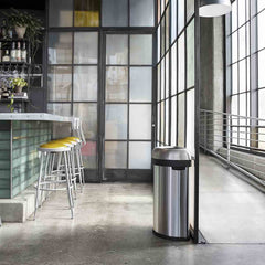 60L semi-round open bin - brushed stainless steel - lifestyle in restaurant