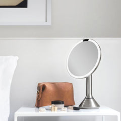 sensor mirror with touch-control brightness and dual light setting - brushed finish - lifestyle in bedroom image