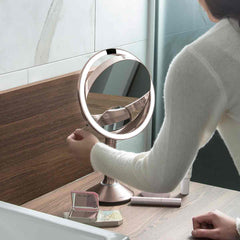 sensor mirror trio - rose gold finish - lifestyle woman flipping mirror